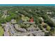 Scenic aerial view of community with pond, golf course, and convenient parking in lush, landscaped setting at 10 Logan Berry Ct. # H, Murrells Inlet, SC 29576