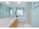 Bright bathroom featuring a double sink vanity, separate shower, and soaking tub at 10 Logan Berry Ct. # H, Murrells Inlet, SC 29576