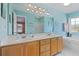 Ensuite bathroom with double vanity, bright blue walls, and separate shower and tub at 10 Logan Berry Ct. # H, Murrells Inlet, SC 29576