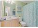 Bright bathroom featuring a single vanity, decorative shower curtain, and starfish decor for a beach-themed ambiance at 10 Logan Berry Ct. # H, Murrells Inlet, SC 29576