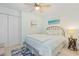 Inviting bedroom with a full size bed, side table, ceiling fan, and closet at 10 Logan Berry Ct. # H, Murrells Inlet, SC 29576