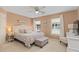 Cozy bedroom featuring a patterned comforter, neutral walls, and bright natural light at 10 Logan Berry Ct. # H, Murrells Inlet, SC 29576