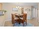 Inviting dining area with a wooden table, seating for six, and decor accents making it a happy place at 10 Logan Berry Ct. # H, Murrells Inlet, SC 29576