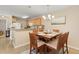 Charming dining space with a wooden table and seating, adjacent to the kitchen, perfect for Gathering meals at 10 Logan Berry Ct. # H, Murrells Inlet, SC 29576