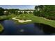 Picturesque view of the lush green golf course with water features and manicured landscaping at 10 Logan Berry Ct. # H, Murrells Inlet, SC 29576
