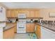 Bright kitchen with stainless steel appliances, light wood cabinets and granite countertops at 10 Logan Berry Ct. # H, Murrells Inlet, SC 29576