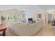 Spacious living room featuring an oversized sectional sofa, bright windows, and an open floor plan at 10 Logan Berry Ct. # H, Murrells Inlet, SC 29576