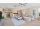 Inviting living area with a large sectional sofa, ceiling fan, and open layout to the kitchen at 10 Logan Berry Ct. # H, Murrells Inlet, SC 29576