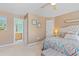 Comfortable main bedroom showcases ensuite bath, soft decor, and natural light at 10 Logan Berry Ct. # H, Murrells Inlet, SC 29576