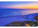 Scenic aerial view of a beach featuring the ocean meeting the shoreline with a beautiful sunrise or sunset at 110 Portsmith Dr. # 8, Myrtle Beach, SC 29588