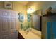 Bright and functional bathroom with a single sink vanity, beach-themed decor and ample storage at 110 Portsmith Dr. # 8, Myrtle Beach, SC 29588