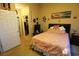 Bedroom with a bed, artwork, nightstands, closet, and a door leading to the hallway, creating a cozy atmosphere at 110 Portsmith Dr. # 8, Myrtle Beach, SC 29588