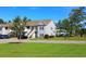 Exterior of residential buildings with a staircase, landscaping, and green space, showcasing the community at 110 Portsmith Dr. # 8, Myrtle Beach, SC 29588