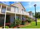 Beautiful condo exterior with spacious balcony, lush landscaping, and well-maintained grounds on a sunny day at 110 Portsmith Dr. # 8, Myrtle Beach, SC 29588