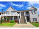 Inviting two-story condo building with a well-maintained lawn, balconies, and convenient stair access at 110 Portsmith Dr. # 8, Myrtle Beach, SC 29588