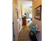 Inviting hallway with coastal decor leads into the kitchen and living areas, showcasing the home's charm at 110 Portsmith Dr. # 8, Myrtle Beach, SC 29588