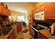 Well-equipped kitchen with stainless steel appliances and granite countertops opens to the dining area at 110 Portsmith Dr. # 8, Myrtle Beach, SC 29588