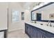 Bathroom featuring a double vanity with marble countertop and large mirror at 130 Ashton Circle, Myrtle Beach, SC 29588