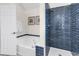 Bathroom with a soaking tub and walk-in shower with blue subway tile at 130 Ashton Circle, Myrtle Beach, SC 29588