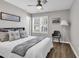 Cozy bedroom featuring a ceiling fan, window with shutters, and stylish decorative pillows on the bed at 130 Ashton Circle, Myrtle Beach, SC 29588