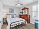 Cozy bedroom with a full-sized bed, dresser, and comfortable chair at 130 Ashton Circle, Myrtle Beach, SC 29588