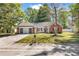 Charming single-story home featuring a well-manicured front lawn and attached two-car garage at 130 Ashton Circle, Myrtle Beach, SC 29588