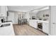 Open-concept kitchen boasting stainless steel appliances, an island with a beverage refrigerator, and a dining area at 130 Ashton Circle, Myrtle Beach, SC 29588