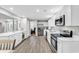 Modern kitchen features stainless steel appliances, an island, and an open layout at 130 Ashton Circle, Myrtle Beach, SC 29588