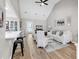 Bright, open-concept living room featuring vaulted ceilings and seamless flow to the kitchen at 130 Ashton Circle, Myrtle Beach, SC 29588