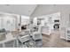 Spacious living area with vaulted ceiling seamlessly transitions to the dining room and modern kitchen at 130 Ashton Circle, Myrtle Beach, SC 29588