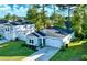 Desirable property showcasing a well-kept lawn, attractive landscaping, and a two-car garage at 147 Marsh Deer Place, Surfside Beach, SC 29575
