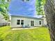 Serene backyard with a patio, comfortable seating, and a well-maintained lawn, perfect for outdoor living at 147 Marsh Deer Place, Surfside Beach, SC 29575