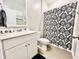 A modern bathroom with a decorative shower curtain and sink at 147 Marsh Deer Place, Surfside Beach, SC 29575