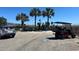 Designated beach parking area with clearly marked spaces, golf cart stalls, and convenient access to the beach at 147 Marsh Deer Place, Surfside Beach, SC 29575