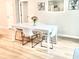 Contemporary dining space featuring a white table with seating for four at 147 Marsh Deer Place, Surfside Beach, SC 29575