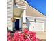 Inviting entrance with a charming front porch, lush flowers, and a welcoming vibe, highlighting curb appeal at 147 Marsh Deer Place, Surfside Beach, SC 29575