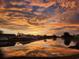 Scenic sunset reflecting on the community lake near the houses at 147 Marsh Deer Place, Surfside Beach, SC 29575