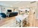 Open-concept living space featuring kitchen, dining, and living areas at 147 Marsh Deer Place, Surfside Beach, SC 29575