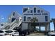 Surfside Beach Pier boasts a diner and ocean views, set against a clear blue sky at 147 Marsh Deer Place, Surfside Beach, SC 29575