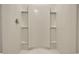 Clean, modern shower with built-in shelves at 147 Marsh Deer Place, Surfside Beach, SC 29575
