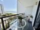Relax on your private balcony with a dining set and picturesque views of the ocean and sky at 2001 S Ocean Blvd. S # 511, Myrtle Beach, SC 29577