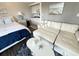 Inviting living area featuring a comfortable white sofa, nautical decor, and an efficient kitchenette at 2001 S Ocean Blvd. S # 511, Myrtle Beach, SC 29577