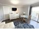 Bright and airy living room boasts modern decor, a dining area, and balcony access for a relaxing experience at 2001 S Ocean Blvd. S # 511, Myrtle Beach, SC 29577