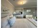 Cozy living space features a kitchenette, seating area, and comfortable queen-size bed with beach-themed decor at 2001 S Ocean Blvd. S # 511, Myrtle Beach, SC 29577