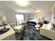 Inviting living space features comfortable seating, a dining table, a queen-size bed, and beach-themed decor at 2001 S Ocean Blvd. S # 511, Myrtle Beach, SC 29577