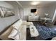 Comfortable seating area features a pull-out sofa, a coffee table, and a blue patterned rug at 2001 S Ocean Blvd. S # 511, Myrtle Beach, SC 29577