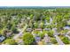 Picturesque aerial view of a residential neighborhood surrounded by lush green forests and tree canopies at 202 Berkshire Dr., Myrtle Beach, SC 29588