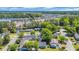Overhead view of neighborhood with landscaped yards, mature trees, and nearby shopping centers at 202 Berkshire Dr., Myrtle Beach, SC 29588