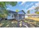 Backyard view of the home featuring a screened in patio at 202 Berkshire Dr., Myrtle Beach, SC 29588