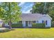 Charming single-story home with a lush green lawn, trimmed hedges, and a welcoming front porch at 202 Berkshire Dr., Myrtle Beach, SC 29588